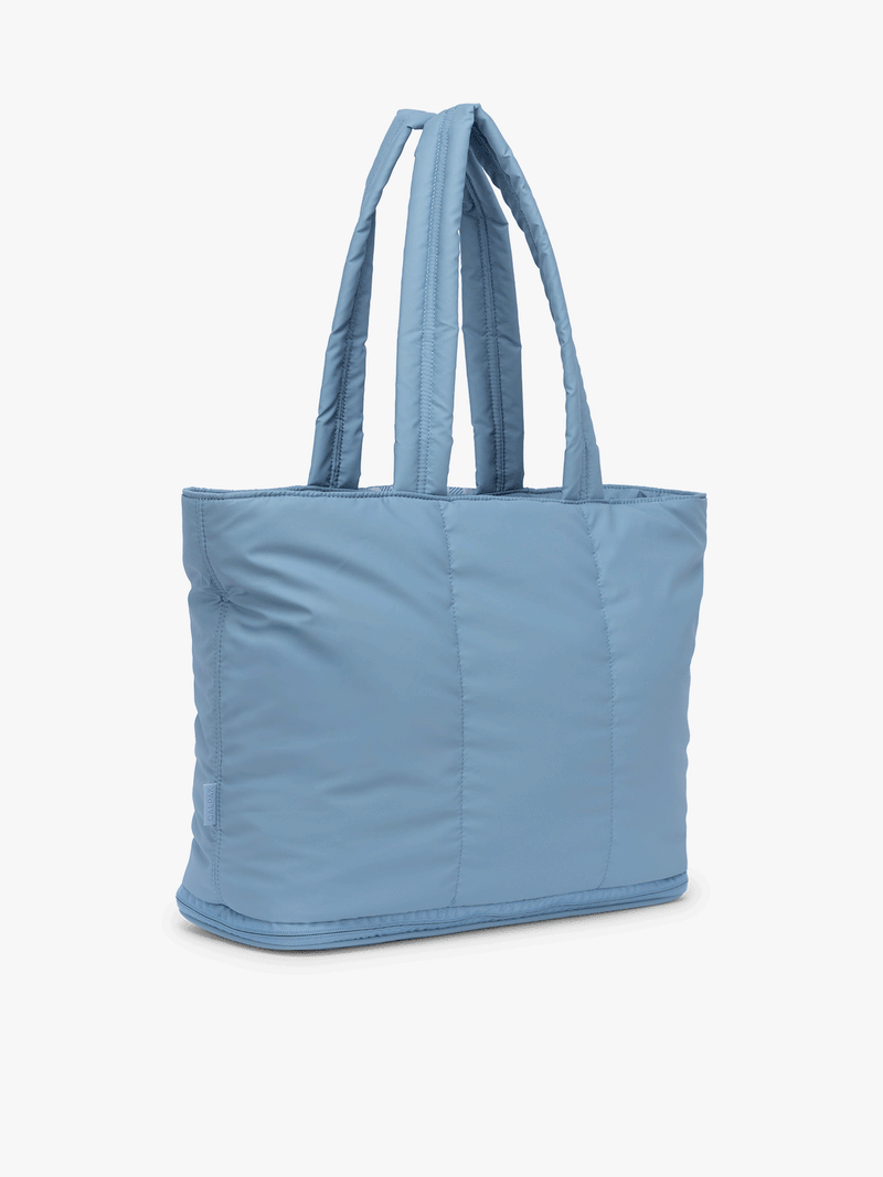 Gif of expandable feature of the CALPAK Luka Expandable Tote in light blue French Blue