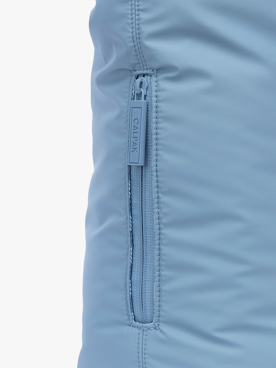 SIde phone pocket with zipper of CALPAK Luka Expandable Tote in light blue French Blue; ALT2201-FRENCH-BLUE