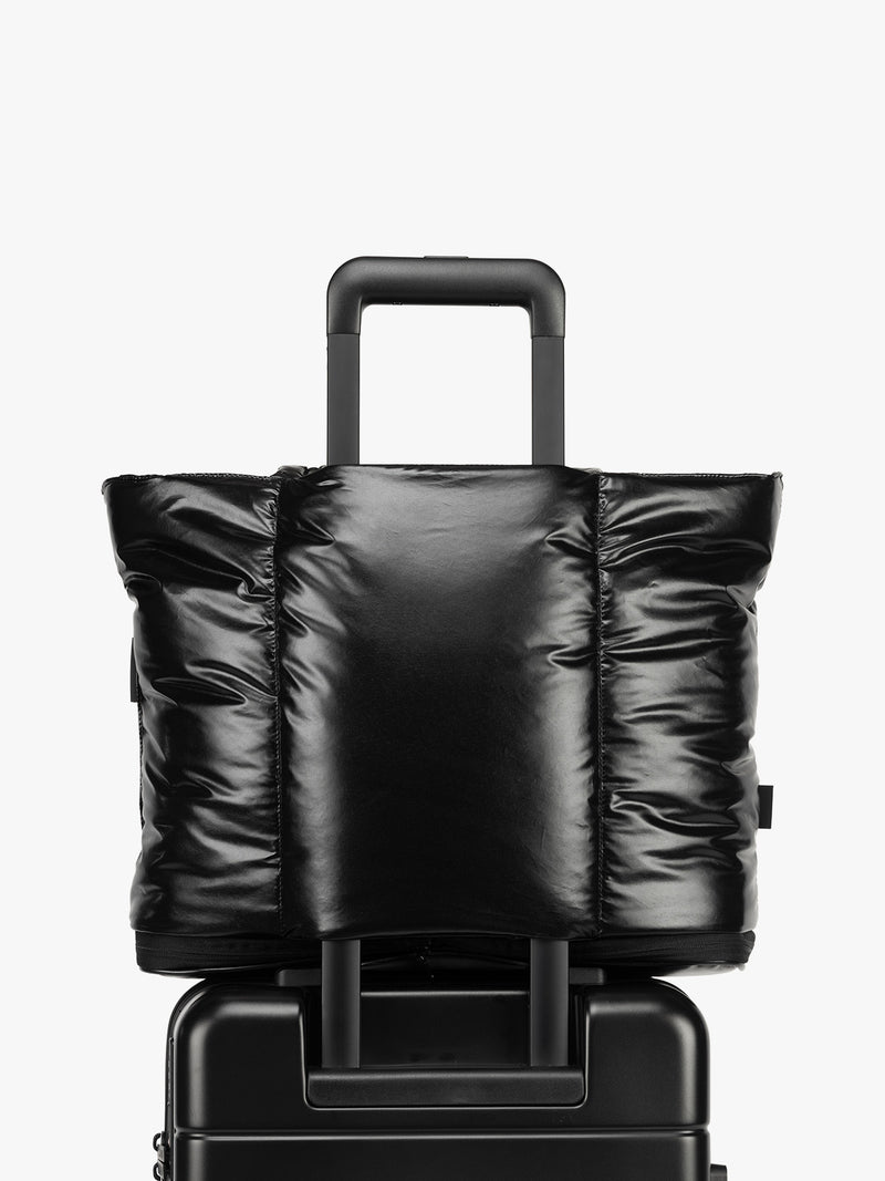 Trolley sleeve of CALPAK Luka Expandable Tote in Glazed Black