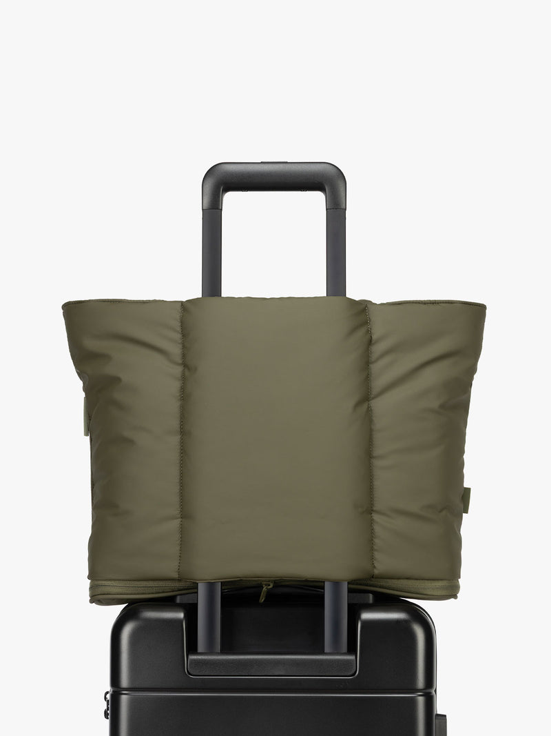 CALPAK Luka Expandable Tote bag in dark green withluggage trolley sleeve