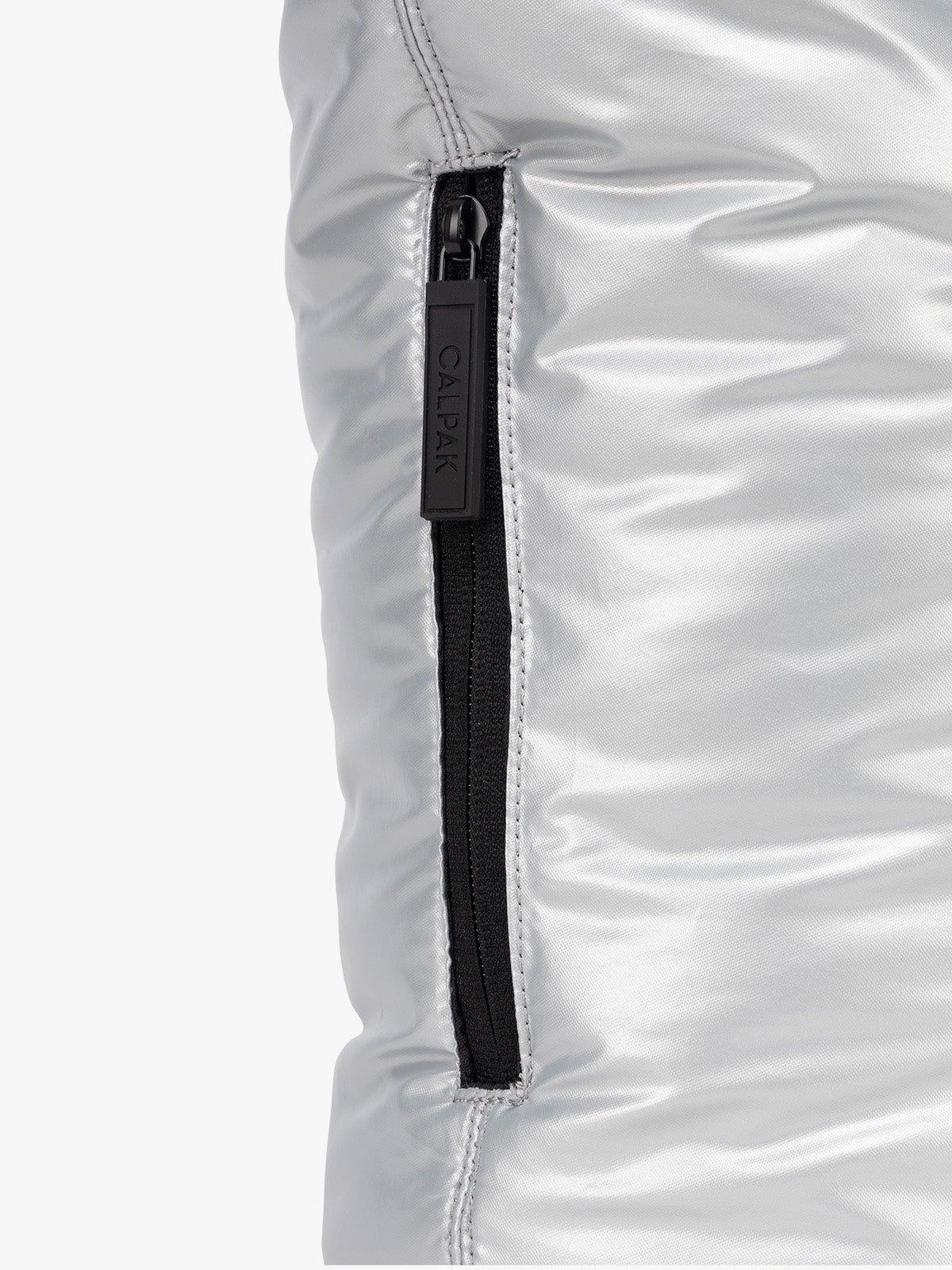 Zoom in zipper of side pocket of CALPAK Luka Expandable Tote in Silver; ALT2201-SILVER