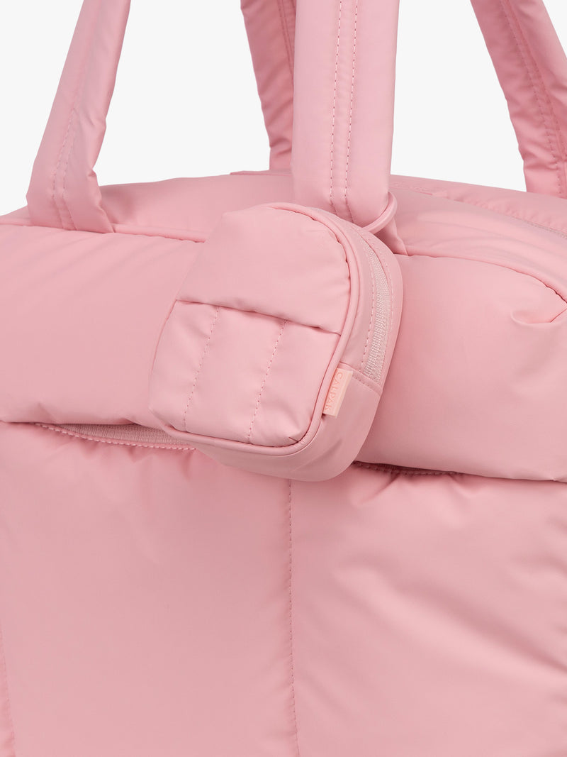 CALPAK Luka Backpack Key Pouch in pink monochrome Blossom attached to Luka Duffel Bag