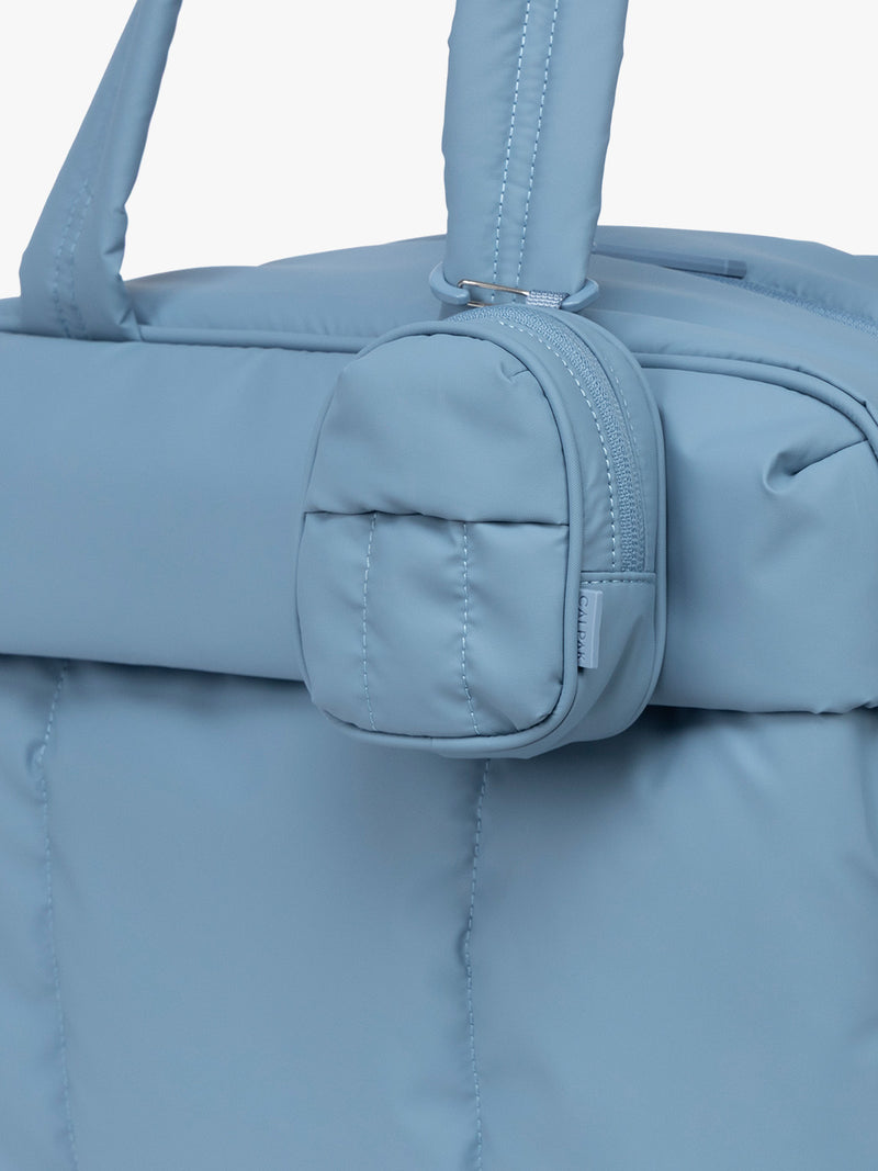 CALPAK Luka Backpack Zip Bag Charm in light blue French Blue clipped on bag