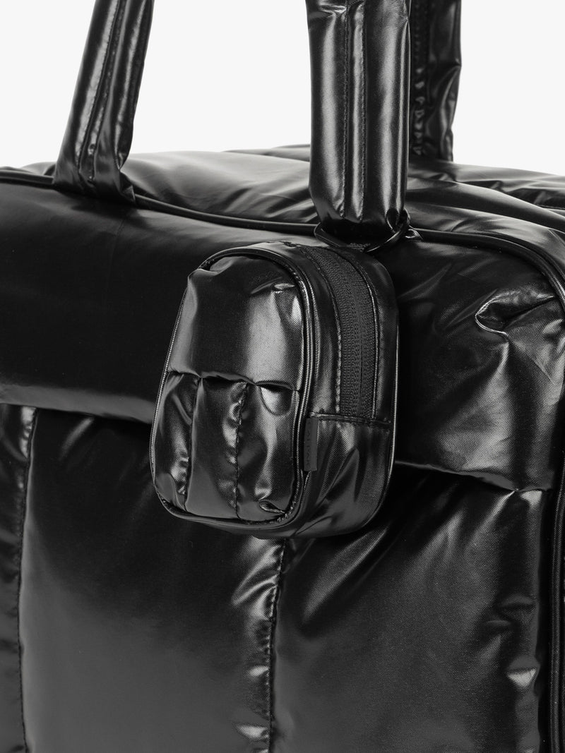 CALPAK Luka Backpack Key Pouch in Glazed Black clipped on bag