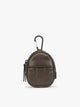 A small brown Mushroom CALPAK Luka Backpack Zip Bag Charm leather backpack keychain with a top carabiner and zipper pull, shown on a plain white background; AMB2201-MUSHROOM-PU