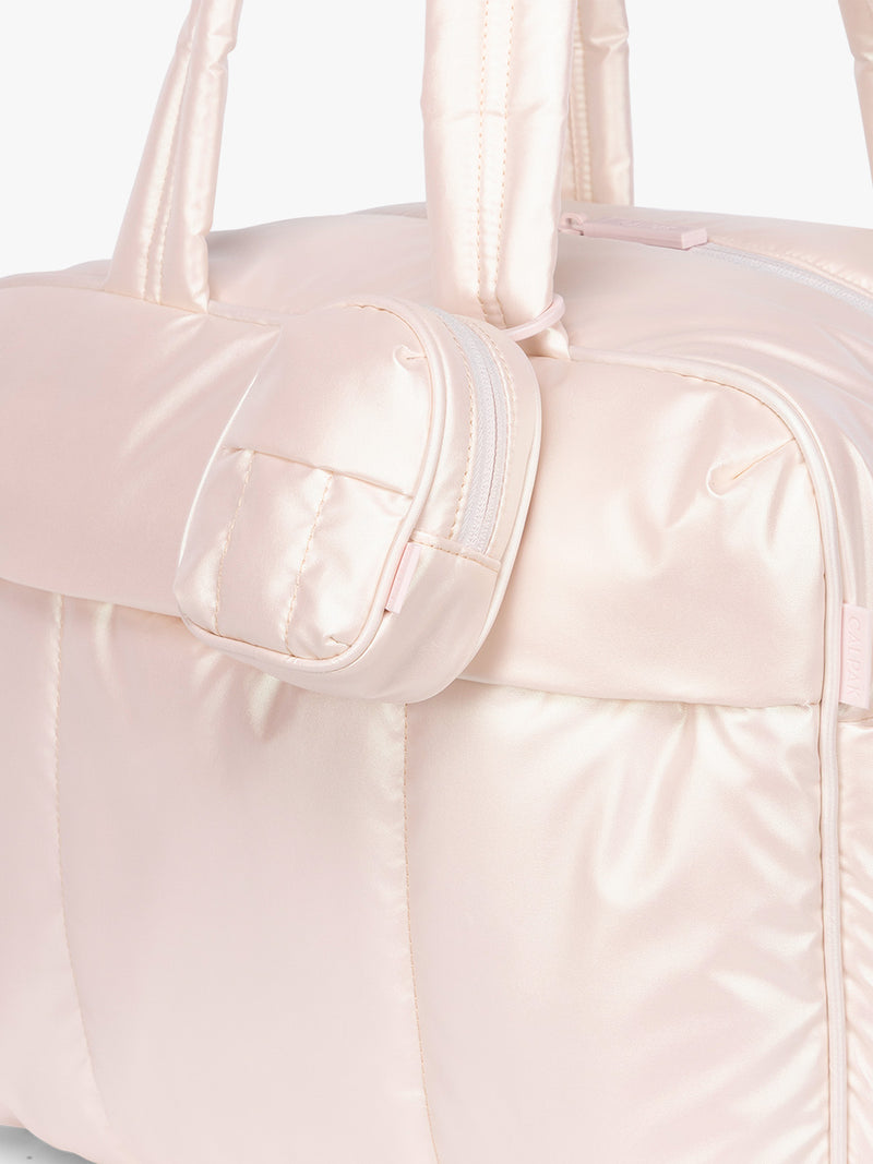 CALPAK Luka Backpack Zip Bag Charm in light pink Pearlescent clipped on bag