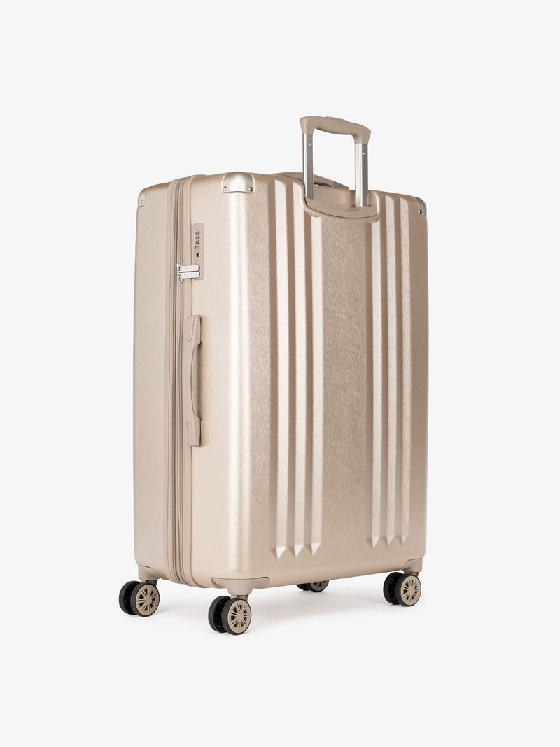 large 30 inch gold lightweight hardside suitcase