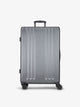 Studio product shot of front-facing CALPAK Ambeur large 30-inch hardshell luggage with 360 spinner wheels in gunmetal; LAM1028-GUNMETAL