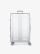 Studio product shot of front-facing CALPAK Ambeur large 30-inch silver hardshell spinner luggage; LAM1028-SILVER