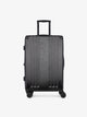 Studio product shot of front-facing CALPAK Ambeur black medium 26-inch lightweight hardshell rolling luggage; LAM1024-BLACK