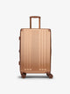 Studio product shot of front-facing CALPAK Ambeur medium 26-inch lightweight hardshell luggage with 360 spinner wheels in copper; LAM1024-COPPER