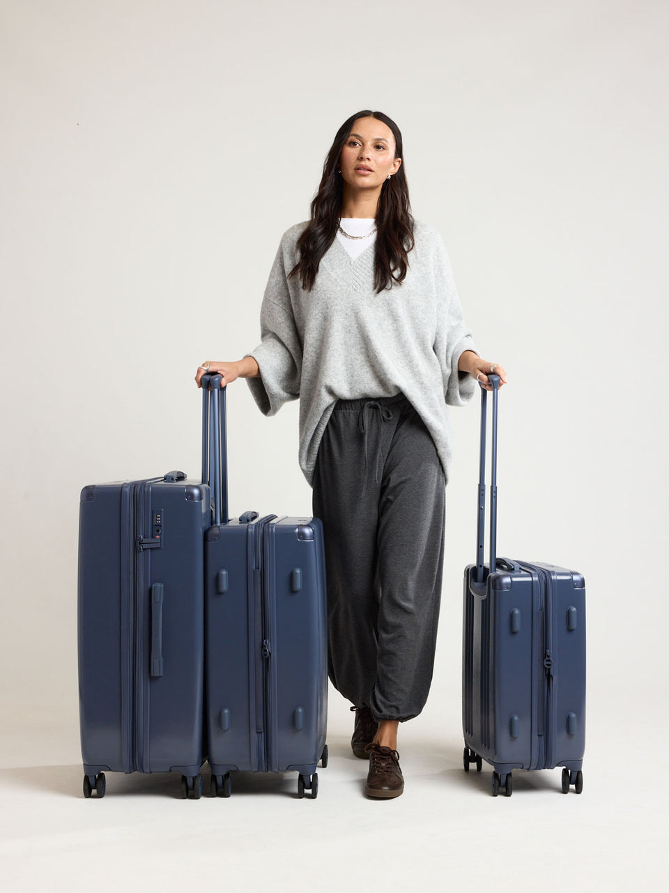 Woman with CALPAK Ambeur 3PC dark blue Metallic Indigo; LAM3000-INDIGO