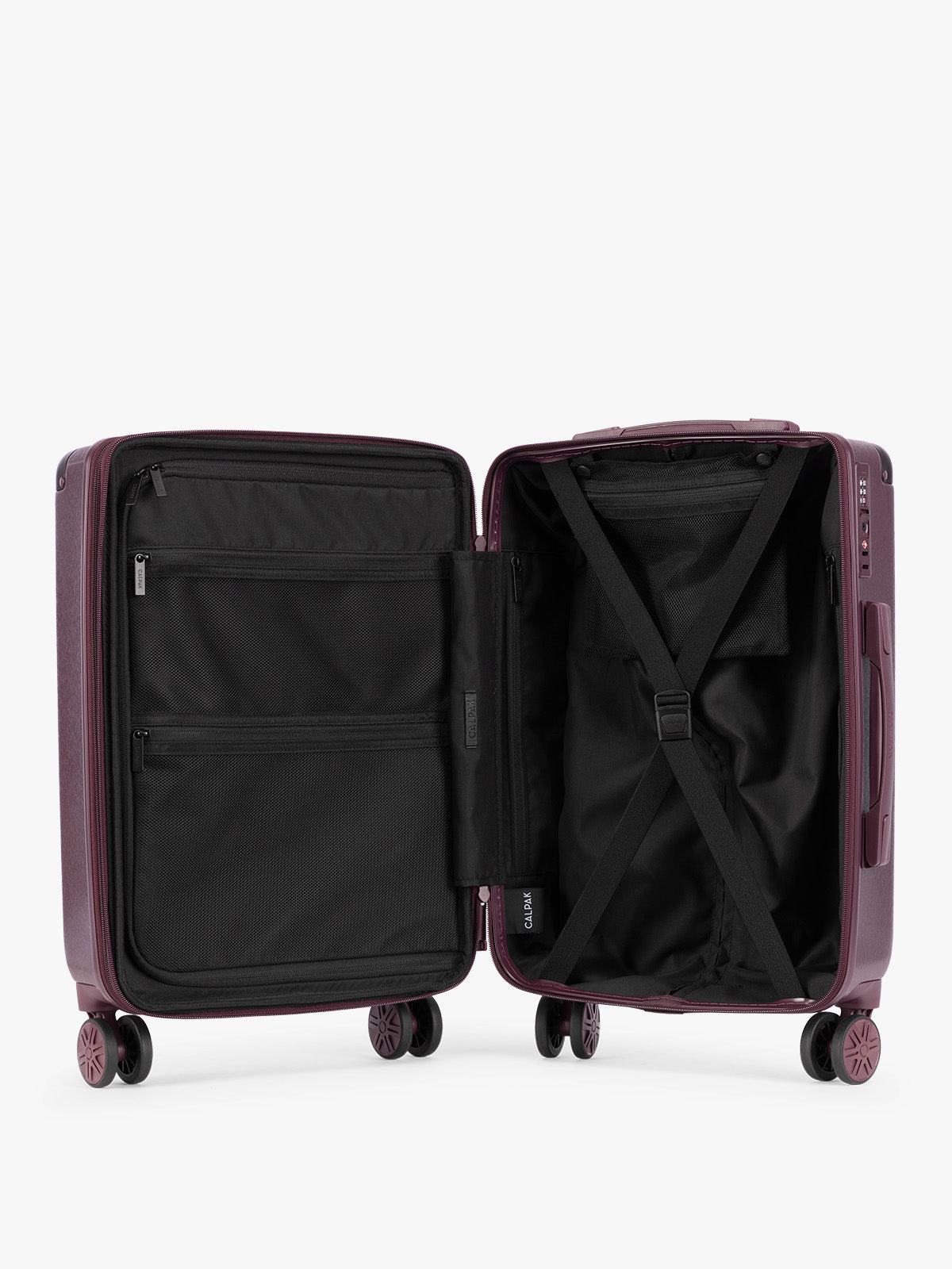 Opened interior showing the CALPAK Ambeur Medium Luggage in dark burgundy Dark Cherry with vertical ribbed detailing and an extended telescoping handle, shown from the front against a plain white background; LAM1024-DARK-CHERRY
