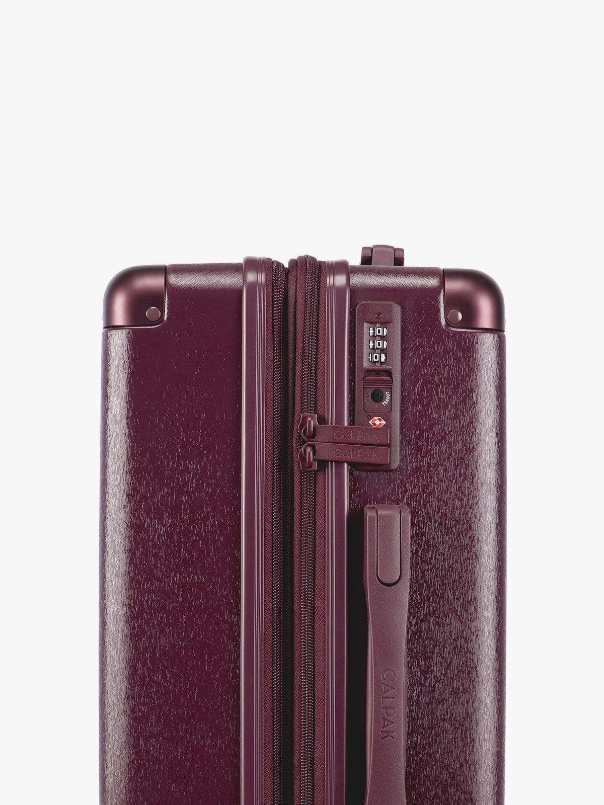 TSA lock closeup of the CALPAK Ambeur Large Luggage in dark burgundy Dark Cherry with vertical ribbed detailing and an extended telescoping handle, shown against a plain white background; LAM1028-DARK-CHERRY