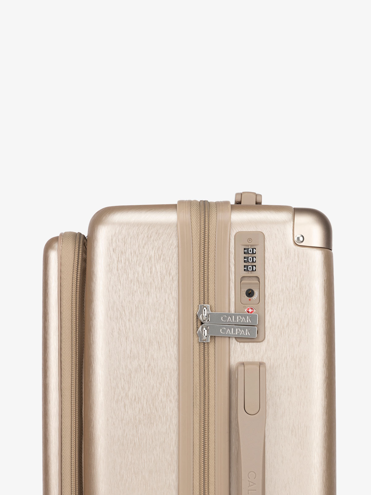 CALPAK Ambuer hardside 21 inch carry-on with front pocket and TSA lock in gold; LAM1020-FP-GOLD