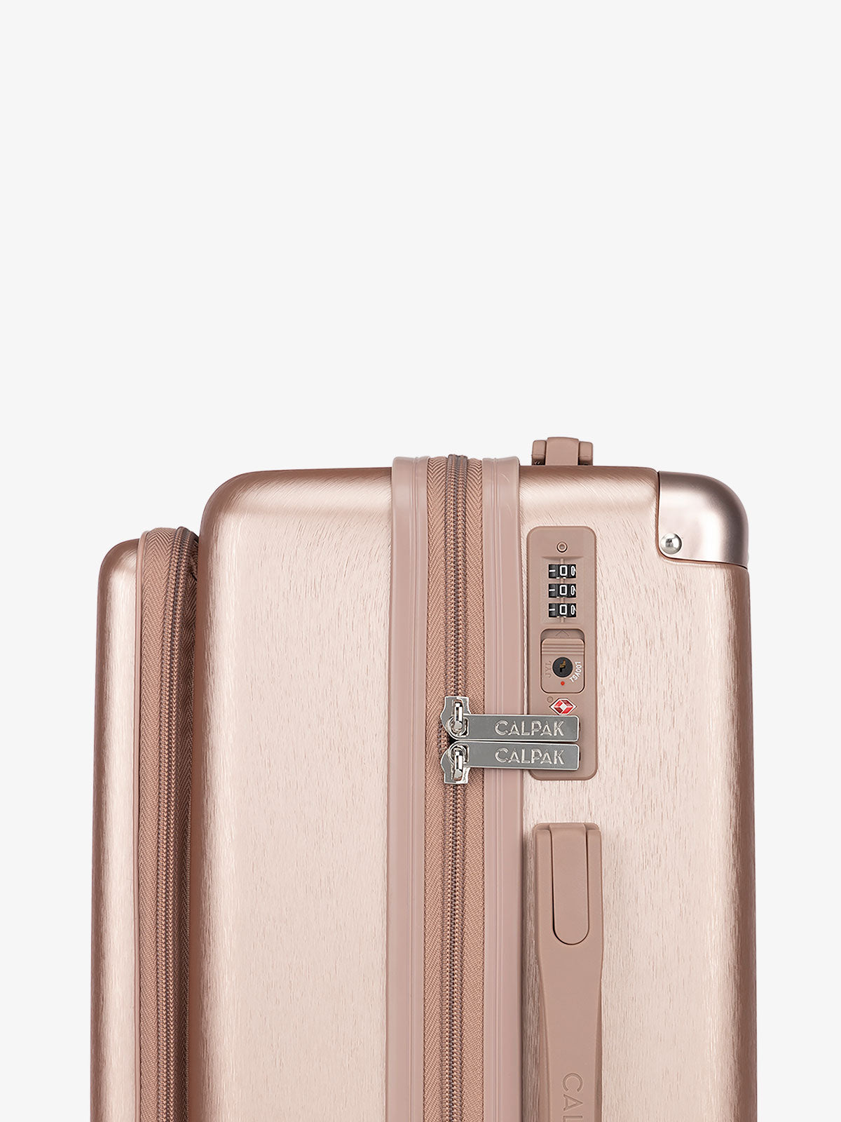 CALPAK Ambuer hardside 21 inch carry-on with front pocket and TSA lock in rose gold; LAM1020-FP-ROSE-GOLD