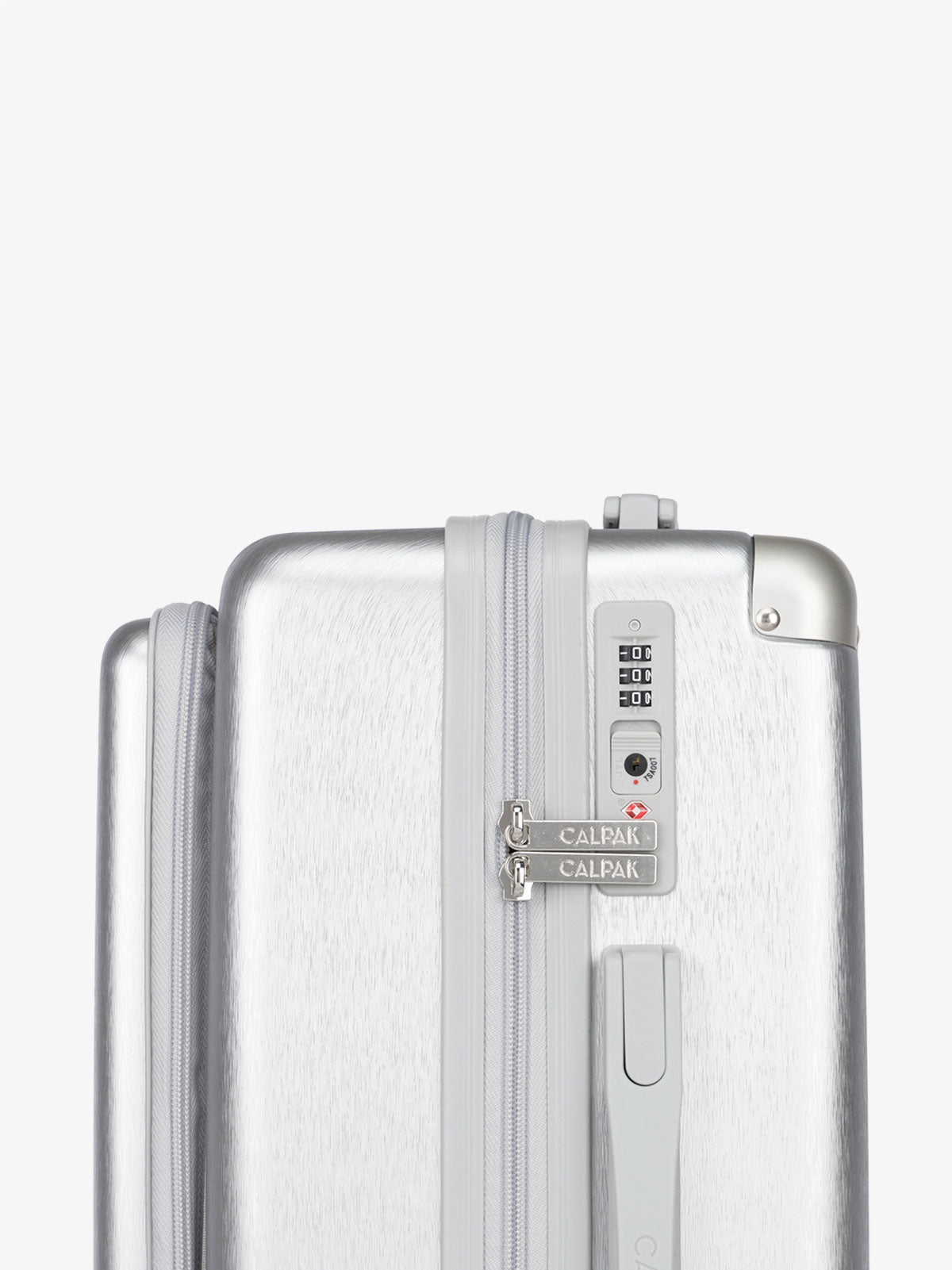 CALPAK Ambuer hardside 21 inch carry-on with front pocket and TSA lock in silver; LAM1020-FP-SILVER