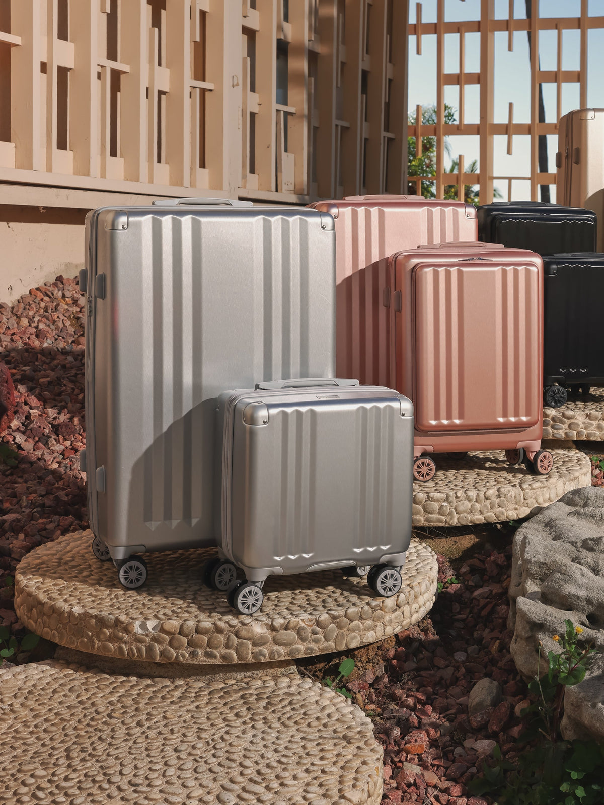 CALPAK Ambuer small carry on luggage with wheels pictured with Ambuer collection luggage in silver; LAM1014-SILVER