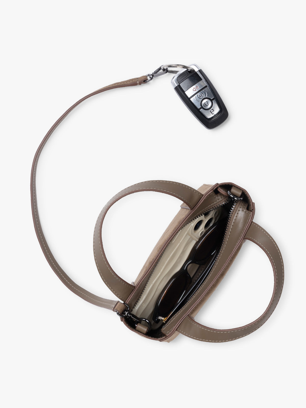 Top view and key line of CALPAK Haven Mini Crossbody Bag in brown Truffle Suede with top handles on a plain white background;  AMC2502-TRUFFLE-FAUX-SUEDE