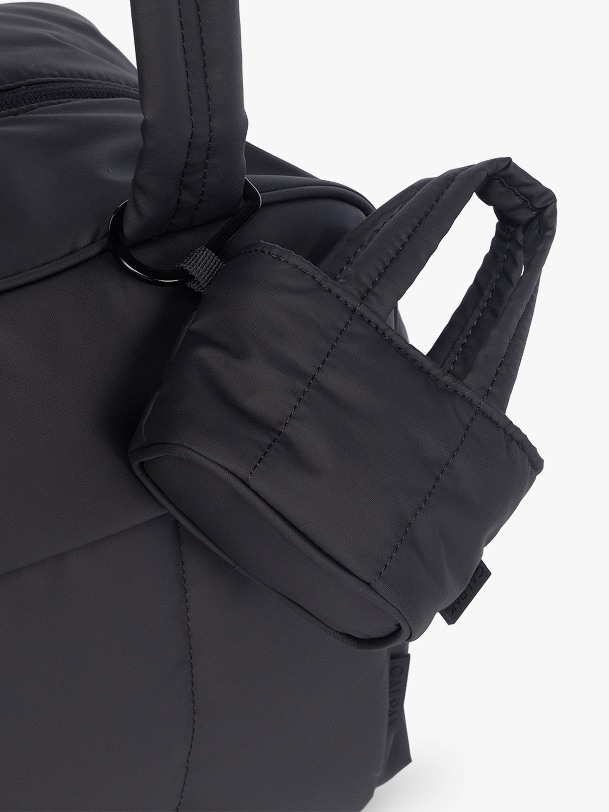CALPAK Luka Tote Zip Bag Charm in Matte Black with carabiner attached to bag; AMT2601-MATTE-BLACK