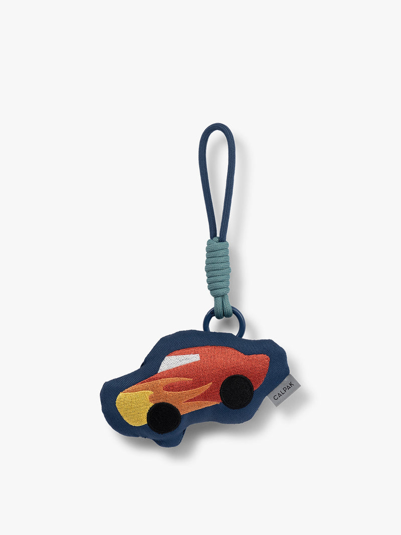 CALPAK Kids Pluffy Bag Charm red Car with flames on dark blue plush front view
