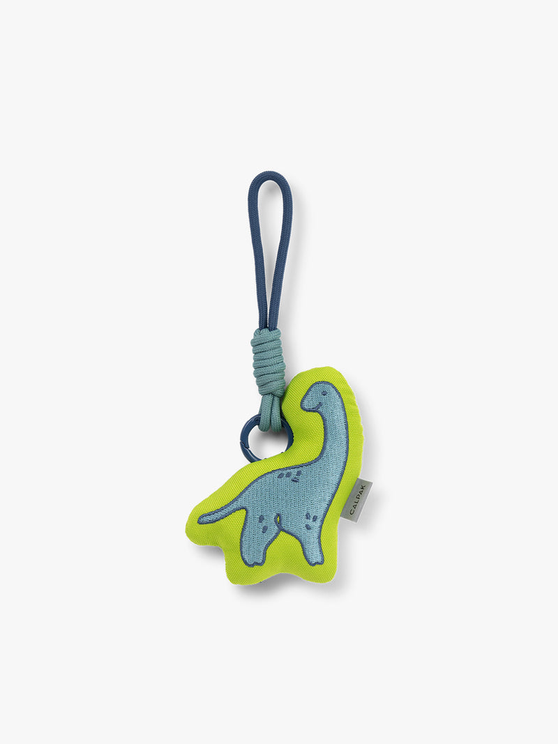 CALPAK Kids Pluffy Bag Charm blue Dinosaur on light green plush front view