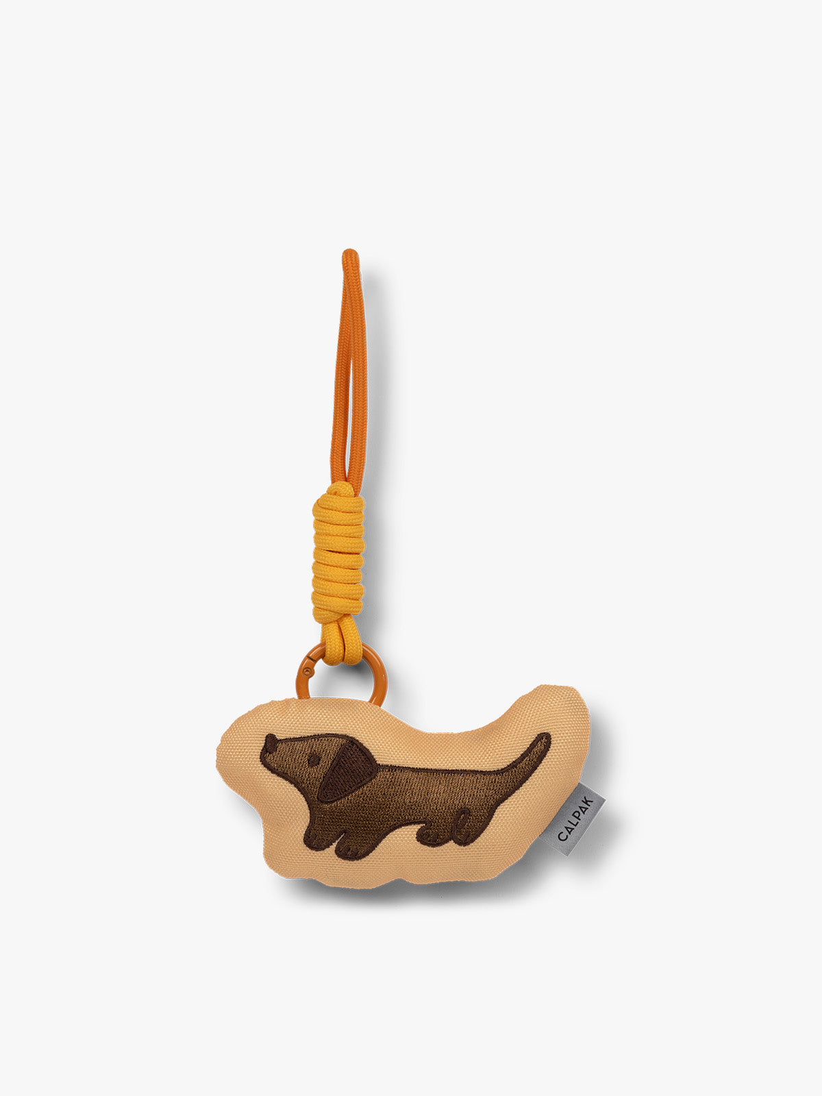 CALPAK Kids Pluffy Bag Charm brown Dog on tan plush front view; APLF2501-DOG