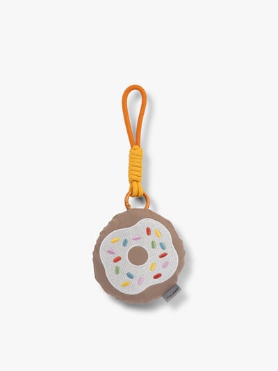 CALPAK Kids Pluffy Bag Charm white Donut with sprinkles on tan plush front view; APLF2501-DONUT
