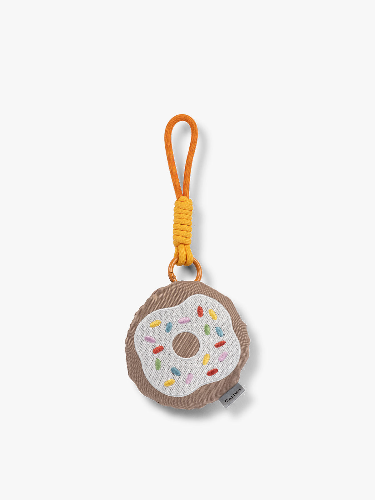 CALPAK Kids Pluffy Bag Charm white Donut with sprinkles on tan plush front view; APLF2501-DONUT