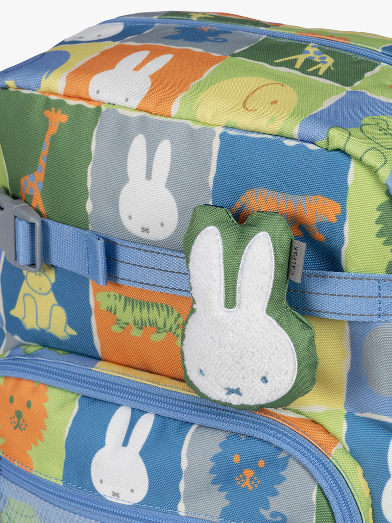 Colorful CALPAK + Miffy Kids Essentials Set with children's Small backpack, lunch bag , pencil case set on a white background with blue accents and Miffy with other animals