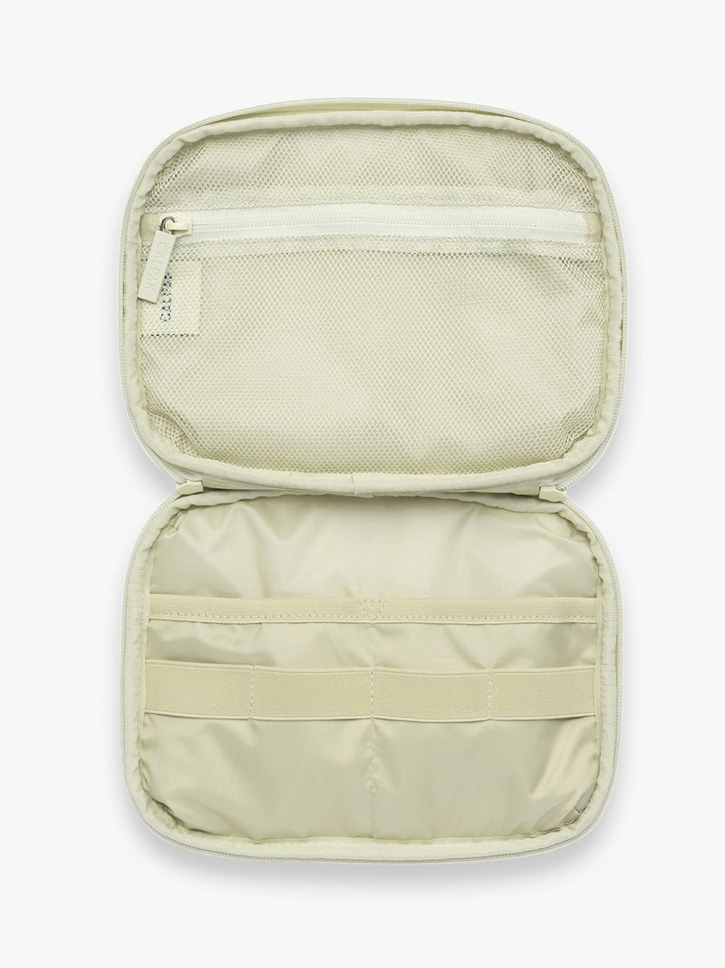 Opened CALPAK Tech Organizer in green and white gingham print with tomato print