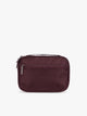 A dark burgundy CALPAK Tech Organizer pouch with a top zipper, front zippered pocket, and a small silver metal brand zipper, shown against a plain white background; ATC2001-DARK-CHERRY