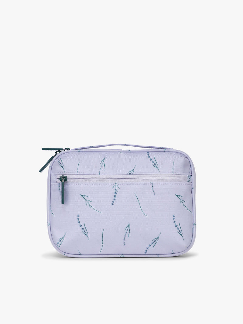 Backside of CALPAK Tech Organizer in light purple with lavender print and green accent zipper in Lavender Bloom