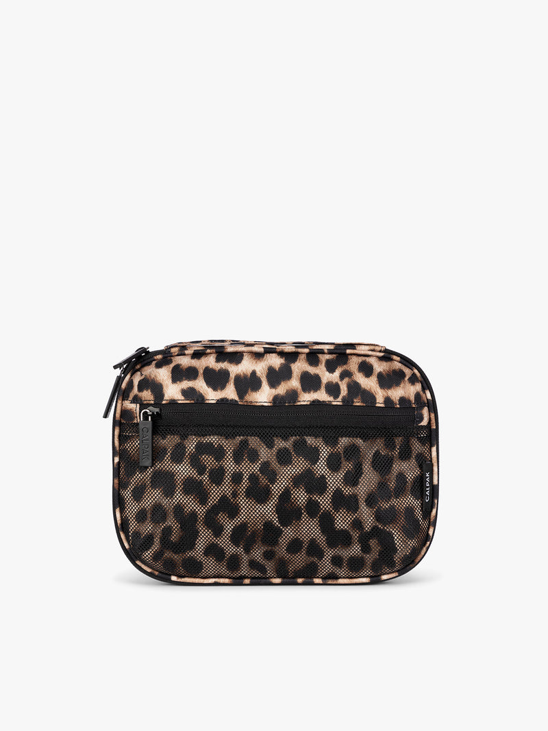 A small rectangular CALPAK Tech Organizer pouch in Leopard with a leopard print pattern in beige, brown, and black, featuring a black horizontal zipper across the front