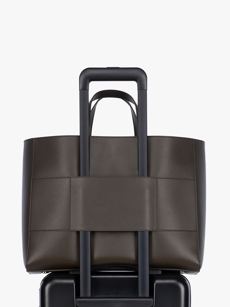 Trolley sleeve of Open gif of CALPAK Haven 16" Laptop Tote in dark brown Mushroom