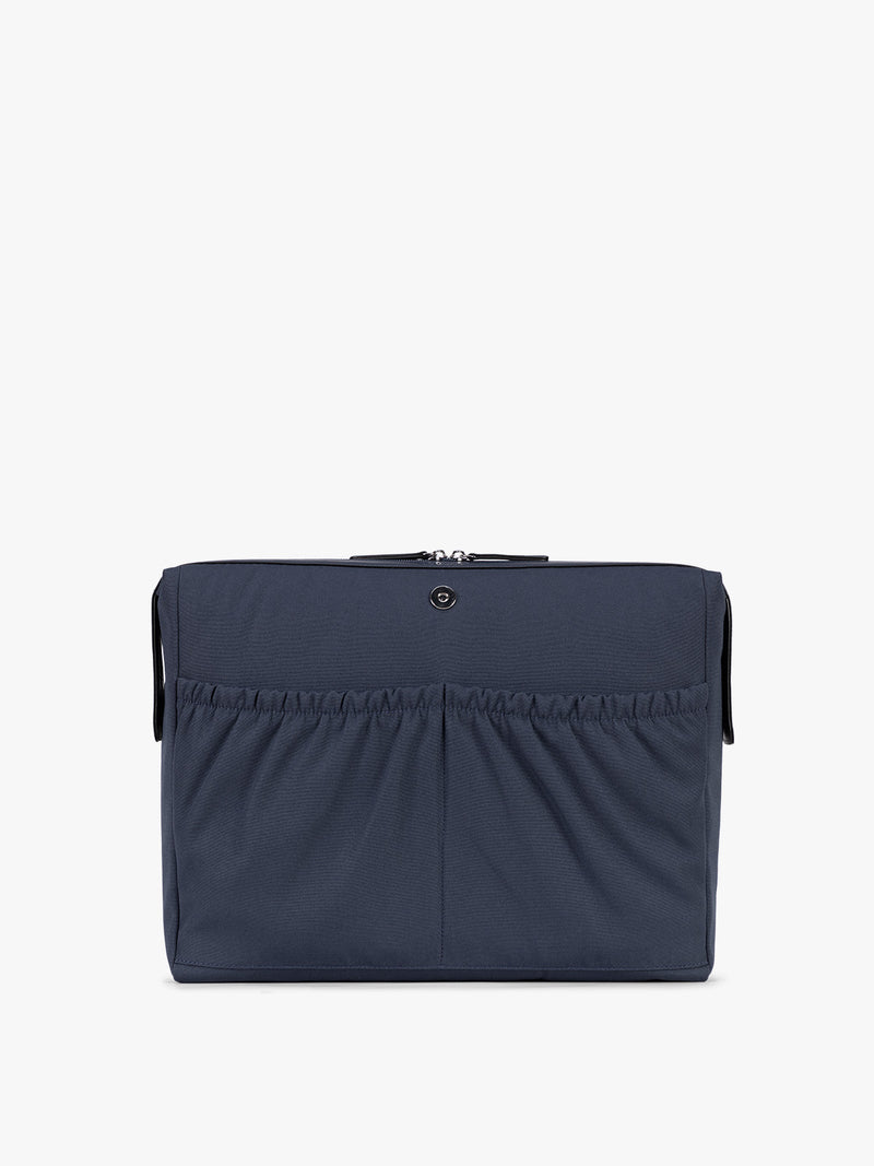Laptop sleeve of CALPAK Haven 16" Laptop Tote in blue Navy crocodile-embossed tote bag with top handles and a detachable shoulder strap, shown against a plain white background