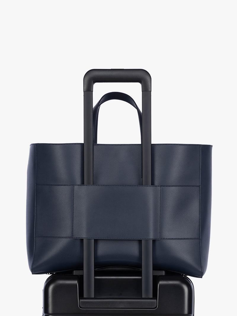 Trolley sleeve of CALPAK Haven 16" Laptop Tote in dark blue Navy
