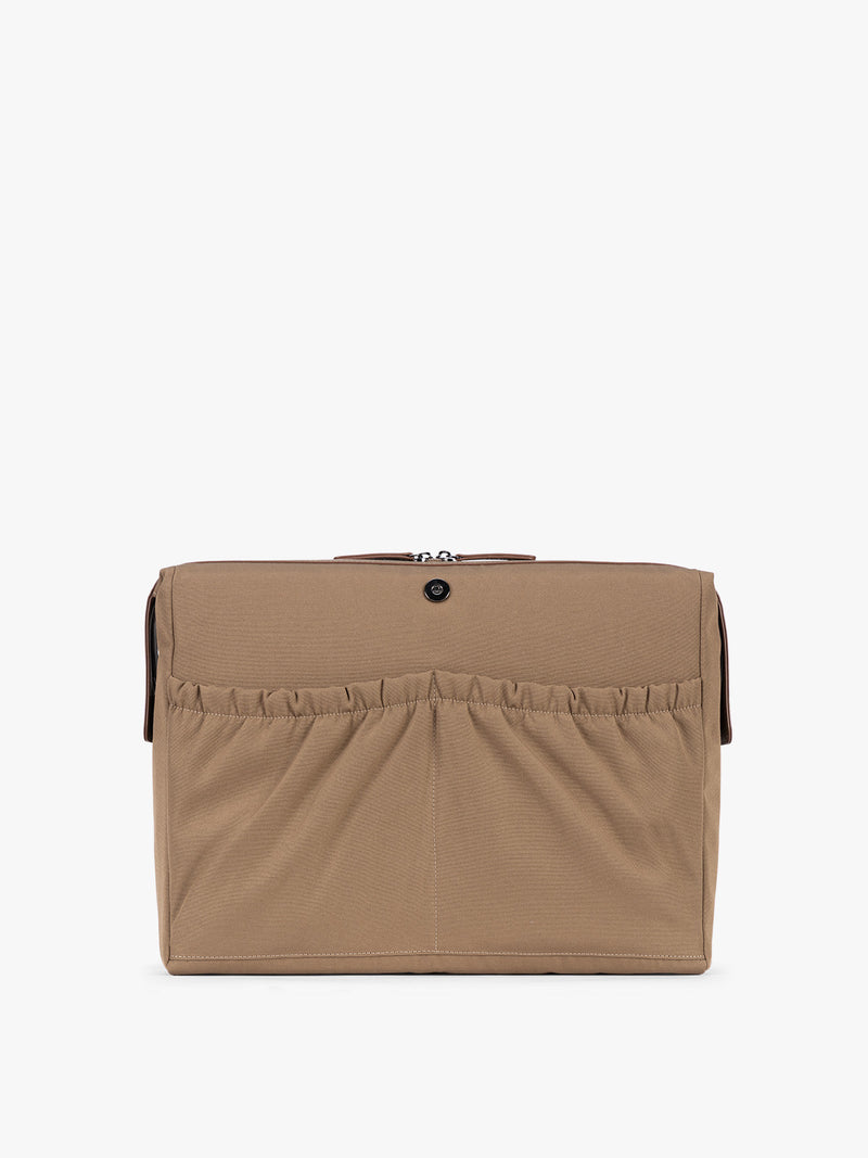 Laptop sleeve of the CALPAK Haven 16" Laptop Tote in Truffle Suede taupe brown tote bag with dual top handles and a matching adjustable shoulder strap, shown against a plain white background