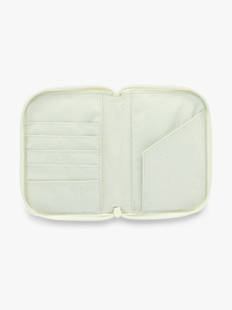 Opened Front side of CALPAK Terra Zip Passport Wallet in light green Celadon