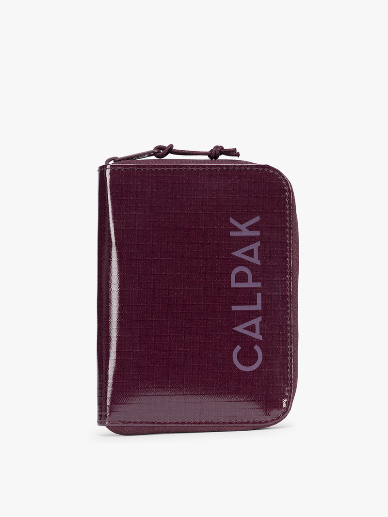 CALPAK Terra Zip Passport Wallet in dark red Dark Cherry on a white background