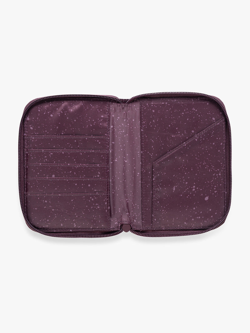 Opened  CALPAK Terra Zip Passport Wallet in dark red Dark Cherry on a white background