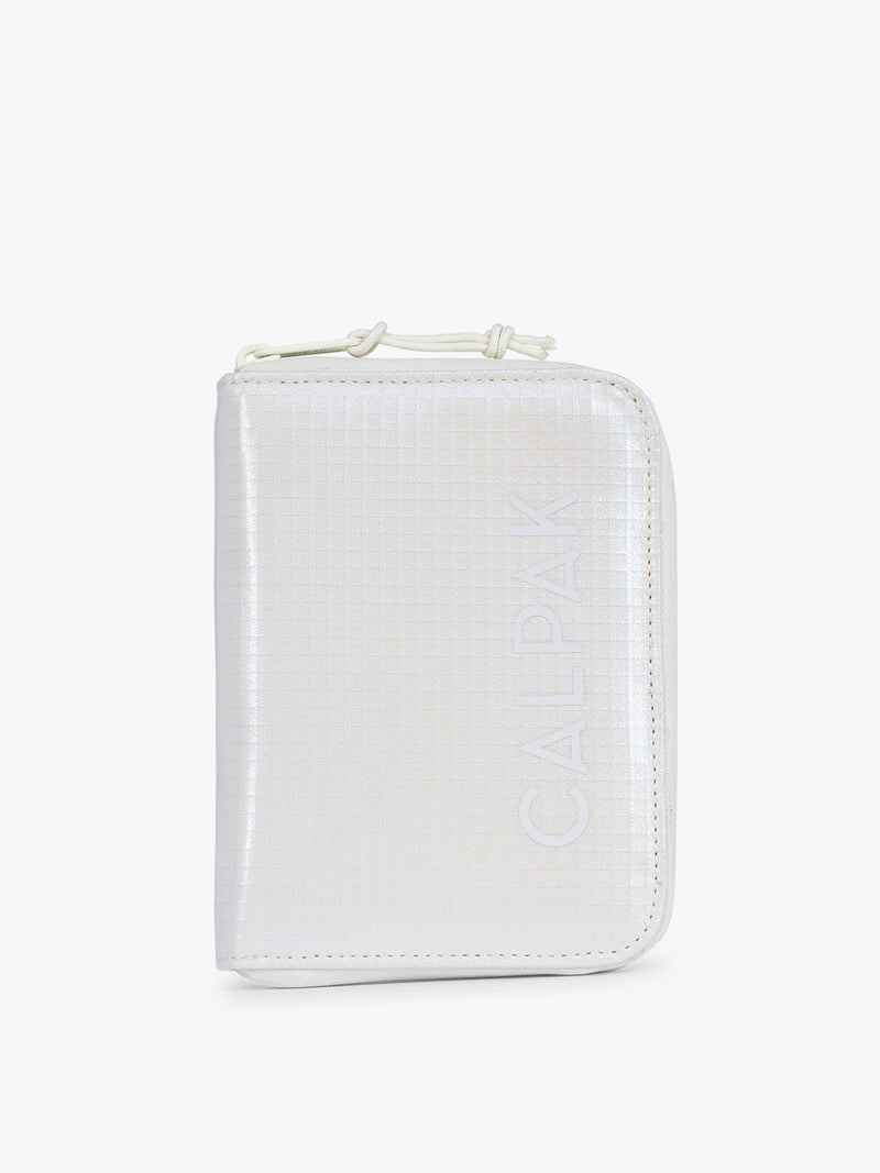 Front side of CALPAK Terra Zip Passport Wallet in shiny white Moonbeam