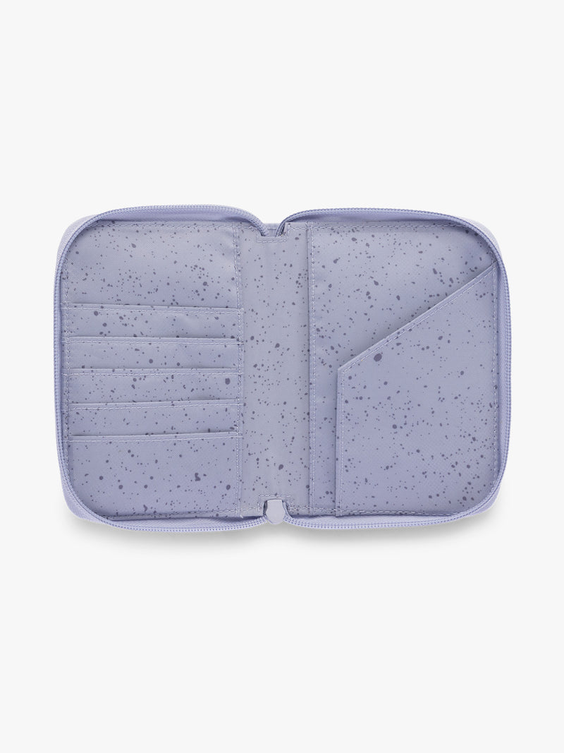 Opened CALPAK Terra Zip Passport Wallet in light purple Sea Glass