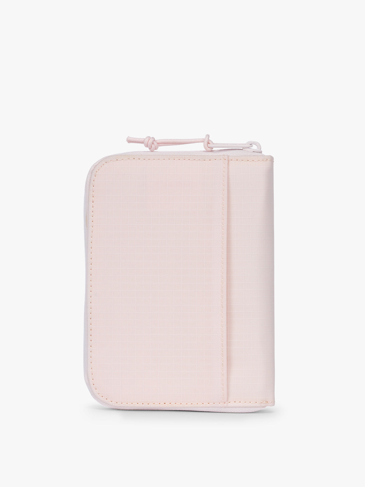 Backside of CALPAK Terra Zip Passport Wallet in light pink Shell Pink; ATPW2501-SHELL-PINK