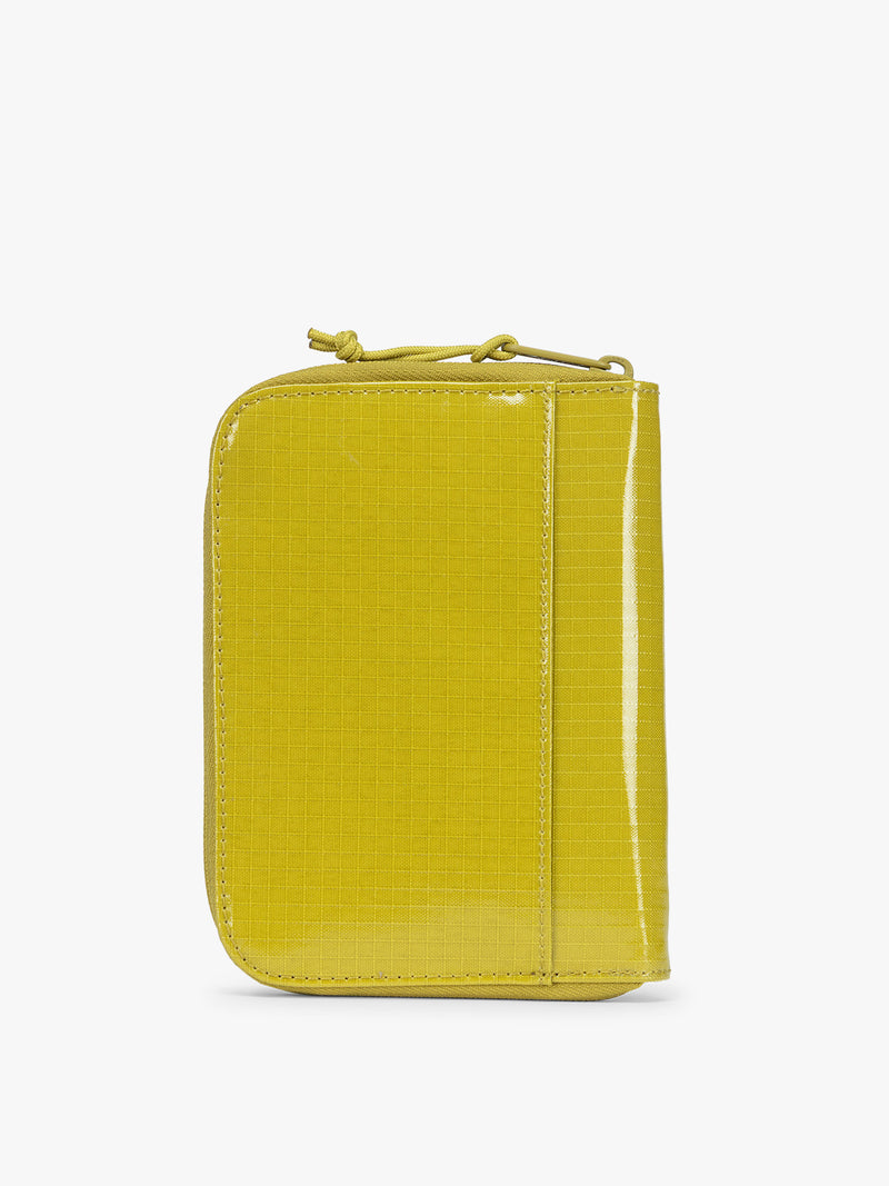 Back view of  CALPAK Terra Zip Passport Wallet in yellow green Wasabi on a white background