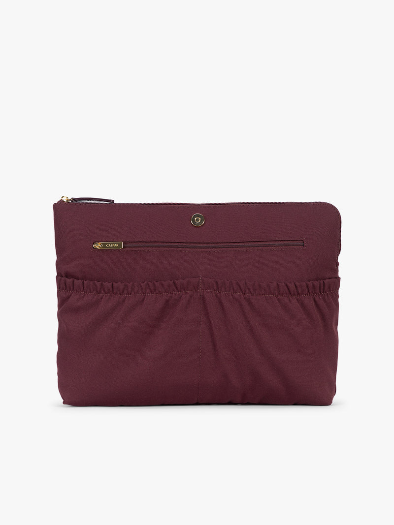 Laptop sleeve of CALPAK Haven 15" Laptop Tote in deep red Dark Cherry crocodile-embossed with dual top handles and a matching shoulder strap against a plain white background