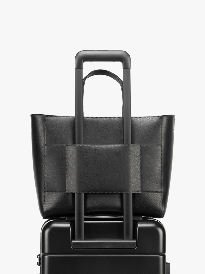 CALPAK Haven 15 inch Laptop Tote in black with trolley sleeve