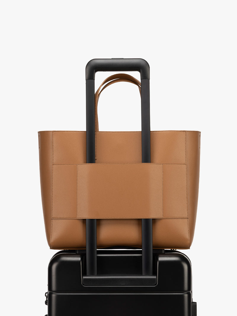 CALPAK Haven 15 inch Laptop Tote in brown Toffee with luggage trolley sleeve