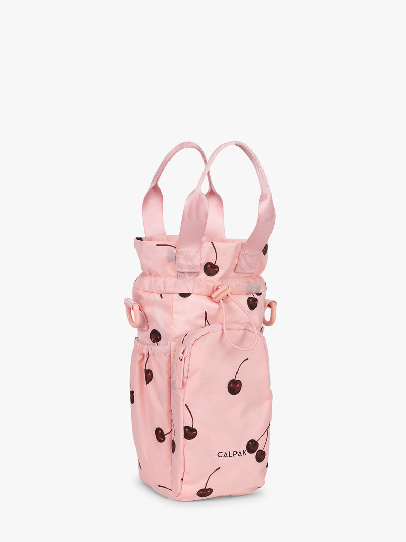 Opened view of CALPAK Water Bottle Holder in Oatmeal Chery in pink with cherry pattern
