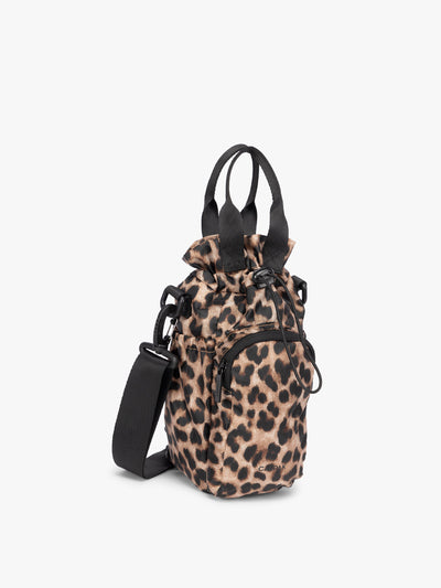 Tan and black animal print Leopard CALPAK Water Bottle Holder with top handles, drawstring top, front zippered pocket, and a detachable shoulder strap; AWH2101-LEOPARD view 1